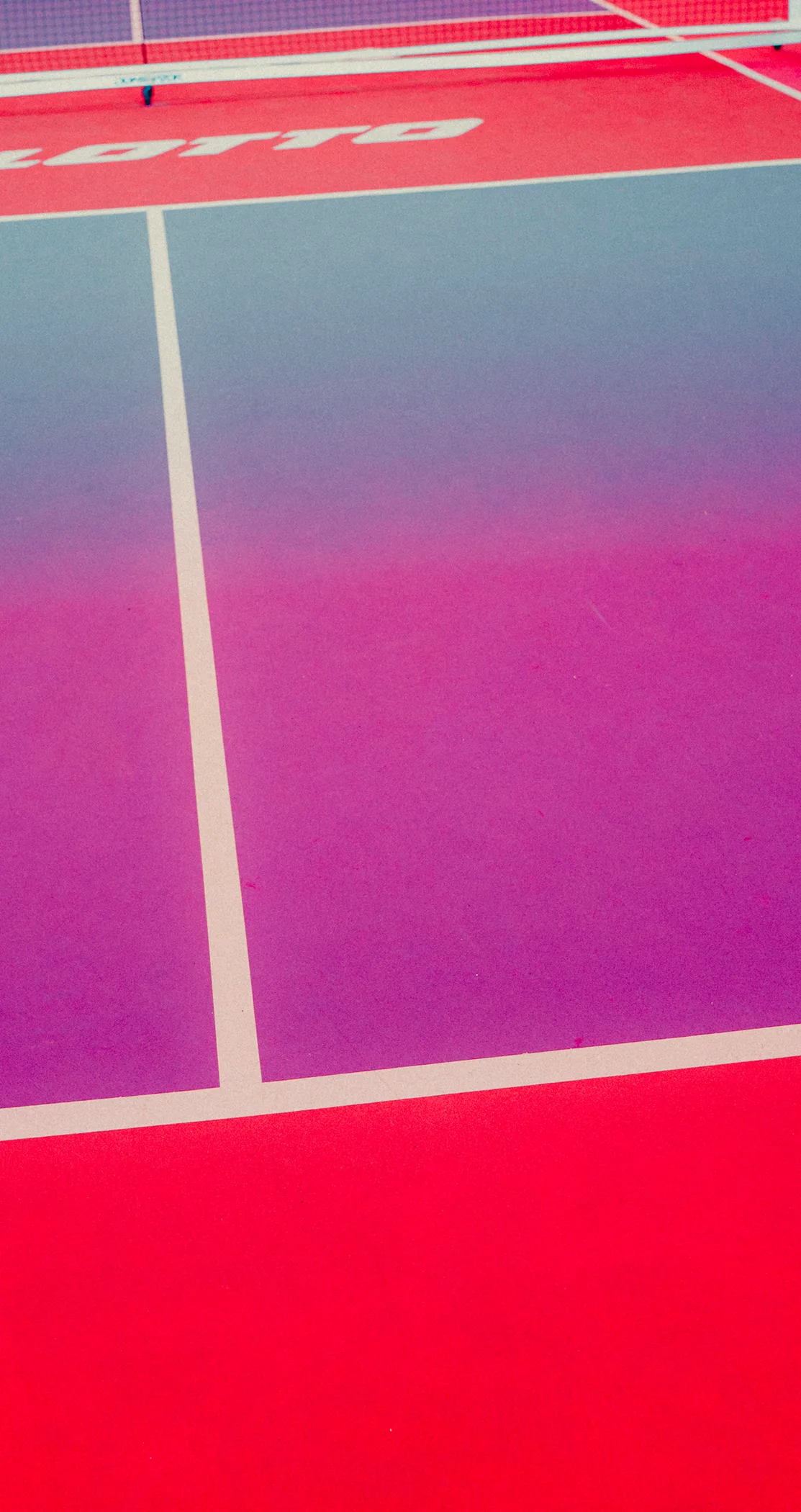 Tennis court in purple and red seen from above with painted lines, Crystal Palace